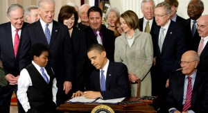 President Obama signs ACA into law